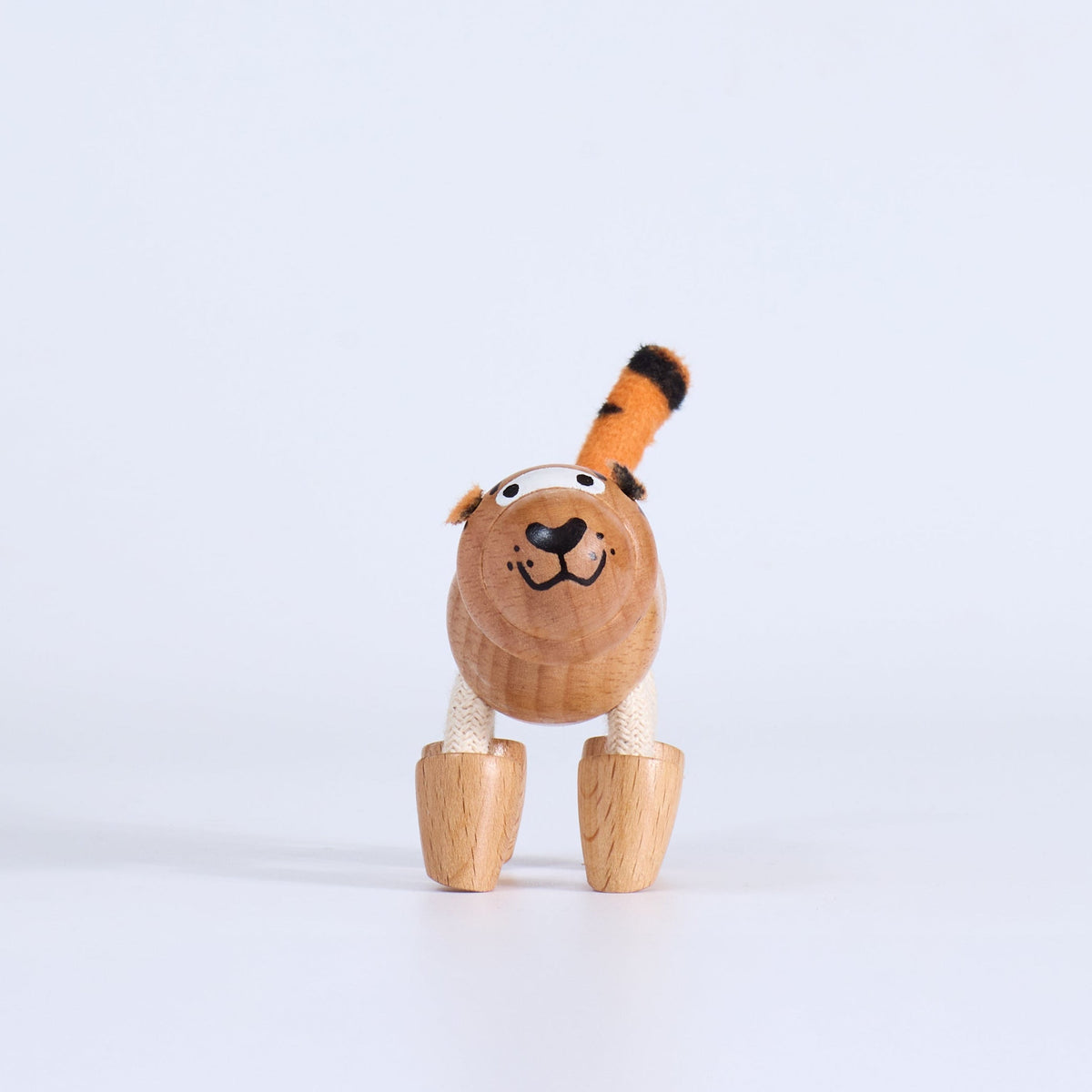 Small toy tiger on a white background